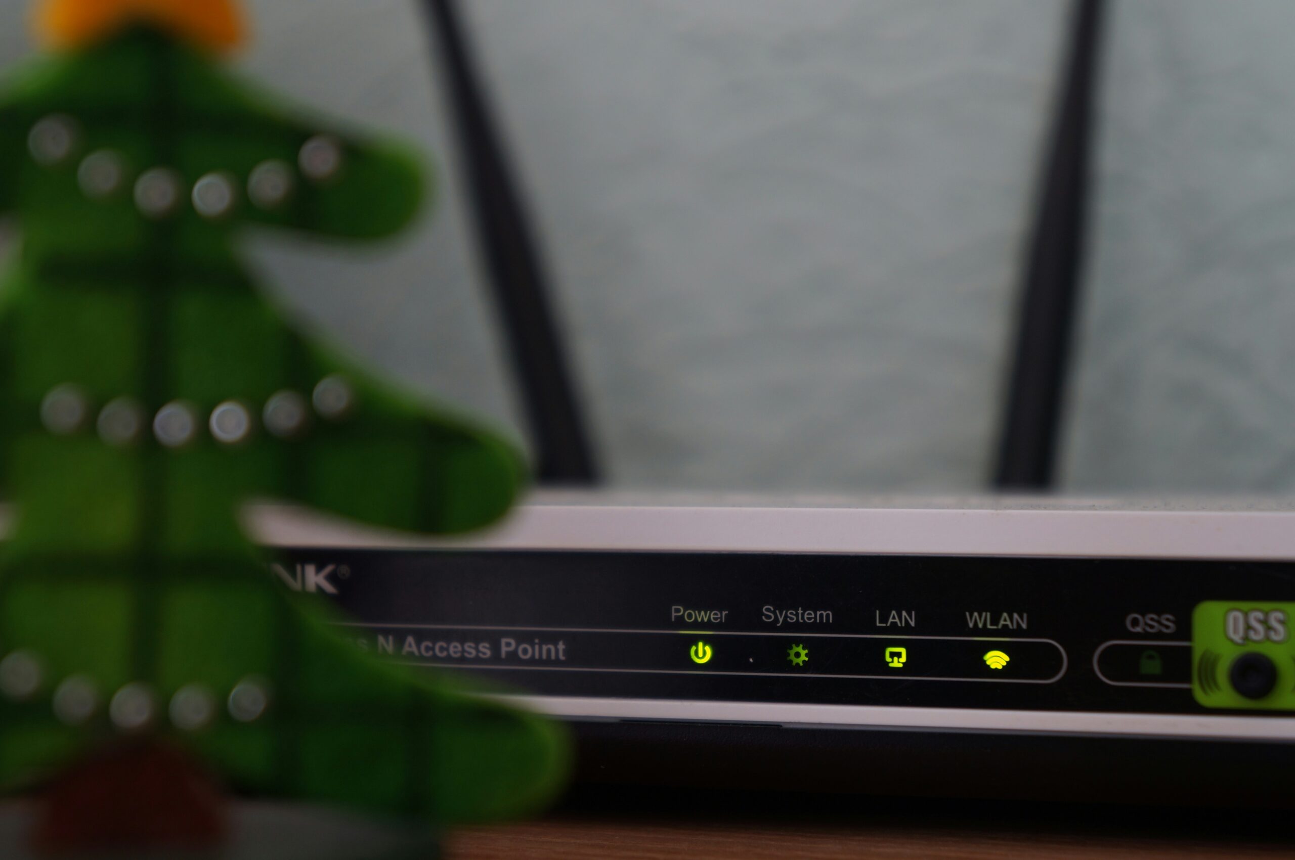 White And Black Modem Router With Four Lights